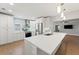 Spacious kitchen with stainless steel appliances, island, and an open layout to the living area at 605 Bosphorous Ave, Tampa, FL 33606