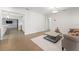 Living room features hardwood floors, views into the kitchen, and access to multiple rooms at 605 Bosphorous Ave, Tampa, FL 33606