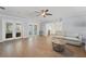 Open living room featuring tile floors, neutral sofa, and a clear view into the kitchen at 605 Bosphorous Ave, Tampa, FL 33606
