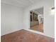 Open-concept living area features tiled floors and access to an adjacent room at 605 Bosphorous Ave, Tampa, FL 33606