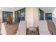 Spacious covered balcony features seating and views; perfect for relaxation and entertaining at 6600 Sunset Way # 118, St Pete Beach, FL 33706