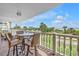 Relaxing balcony offers picturesque ocean views, comfortable seating, and a serene outdoor space at 6600 Sunset Way # 118, St Pete Beach, FL 33706