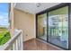 Balcony overlooking the beach with sliding glass doors to the bedroom at 6600 Sunset Way # 118, St Pete Beach, FL 33706
