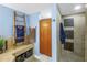 Bathroom includes a shower, a decorative ladder, and neutral tiling at 6600 Sunset Way # 118, St Pete Beach, FL 33706