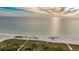 Aerial view of the sandy beach and ocean, perfect for relaxing or swimming in the ocean at 6600 Sunset Way # 118, St Pete Beach, FL 33706