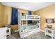bedroom with a white bunk bed, soft carpet, and playful decor creating a cozy space at 6600 Sunset Way # 118, St Pete Beach, FL 33706