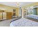 Bedroom boasts a view of the balcony and ample storage space at 6600 Sunset Way # 118, St Pete Beach, FL 33706