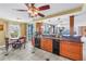 Bright kitchen with granite countertops and views to living spaces and balcony at 6600 Sunset Way # 118, St Pete Beach, FL 33706