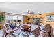 Spacious living room boasting ocean views, comfortable seating, and a TV entertainment center at 6600 Sunset Way # 118, St Pete Beach, FL 33706