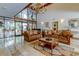 Elegant lobby with comfortable seating, large windows, and a decorative chandelier at 6600 Sunset Way # 118, St Pete Beach, FL 33706