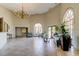 Elegant lobby features tile flooring, comfortable seating, and grand arched windows for a welcoming space at 6600 Sunset Way # 118, St Pete Beach, FL 33706