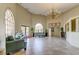 Spacious lobby with high ceilings, elegant seating, and abundant natural light creates a welcoming atmosphere at 6600 Sunset Way # 118, St Pete Beach, FL 33706
