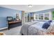 Bright bedroom featuring neutral decor, scenic views, and access to the balcony at 6600 Sunset Way # 118, St Pete Beach, FL 33706