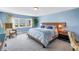 Light blue main bedroom featuring a large window and beach views at 6600 Sunset Way # 118, St Pete Beach, FL 33706