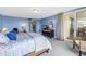 The light-filled bedroom features balcony access and comfortable furnishings at 6600 Sunset Way # 118, St Pete Beach, FL 33706