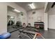 Workout room with free weights, multiple weight benches, a mirrored wall, and stationary bikes for a full workout at 6600 Sunset Way # 118, St Pete Beach, FL 33706