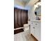 Bathroom featuring vanity sink, a toilet, and a shower with a dark shower curtain at 7320 Hideaway Trl, New Port Richey, FL 34655