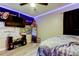 Bedroom offering wood-look vinyl floors, ceiling fan, mounted television and pop-culture decorations at 7320 Hideaway Trl, New Port Richey, FL 34655