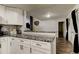 Kitchen featuring granite countertops and modern appliances, perfect for cooking and entertaining at 7320 Hideaway Trl, New Port Richey, FL 34655