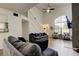 Bright living room featuring hardwood flooring, high ceilings, and large window at 7320 Hideaway Trl, New Port Richey, FL 34655