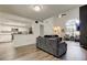 Open floor plan featuring hardwood floors and easy access to the kitchen at 7320 Hideaway Trl, New Port Richey, FL 34655