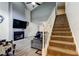 Spacious living room with vaulted ceiling, fireplace, and staircase at 7320 Hideaway Trl, New Port Richey, FL 34655
