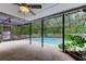 Relaxing screened pool with outdoor seating and landscaped surroundings at 7320 Hideaway Trl, New Port Richey, FL 34655