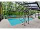 Inviting screened pool with seating, stainless steel ladder and a refreshing escape at 7320 Hideaway Trl, New Port Richey, FL 34655