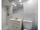Clean bathroom featuring a shower and a vanity with a sink and toilet at 7814 Judith Cres, Port Richey, FL 34668
