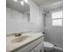 Clean bathroom featuring a tile shower and a vanity with a sink at 7814 Judith Cres, Port Richey, FL 34668