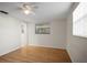 Bright bedroom with wood floors, a ceiling fan and windows at 7814 Judith Cres, Port Richey, FL 34668