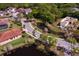 Expansive aerial view captures the serene neighborhood with mature landscaping, water features, and homes under construction at 7849 Marsh Pointe Dr, Tampa, FL 33635