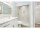 Spa-like bathroom features a glass shower and quartz vanity at 801 Lamont Pl, Temple Terrace, FL 33617