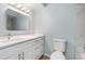 Modern bathroom with quartz counters, neutral walls and new fixtures at 801 Lamont Pl, Temple Terrace, FL 33617