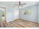 Bedroom has light blue walls, neutral floors, and closet at 801 Lamont Pl, Temple Terrace, FL 33617