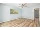 Neutral bedroom with light blue walls, ceiling fan and plenty of natural light at 801 Lamont Pl, Temple Terrace, FL 33617