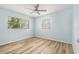 Bedroom features a neutral color palette, ceiling fan and natural light at 801 Lamont Pl, Temple Terrace, FL 33617