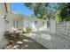 The beautiful home exterior features a white rock garden, double entry doors, and a concrete walkway at 801 Lamont Pl, Temple Terrace, FL 33617