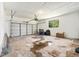 A spacious garage has a high ceiling, an automatic door, and a window that brings natural light at 801 Lamont Pl, Temple Terrace, FL 33617