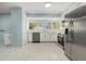 Bright kitchen features stainless steel appliances and ample counter space at 801 Lamont Pl, Temple Terrace, FL 33617