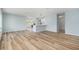 Inviting living area with wood-look flooring, an open layout, and easy access to the kitchen at 801 Lamont Pl, Temple Terrace, FL 33617