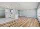 Open-concept living room features modern floors, soft blue walls and a gourmet kitchen area with island at 801 Lamont Pl, Temple Terrace, FL 33617