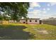 Expansive backyard featuring a well-maintained lawn and a sturdy wooden fence, perfect for outdoor activities and privacy at 8108 Fir Dr, Tampa, FL 33619