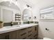 A gorgeous bathroom boasting double sinks, modern mirrors, updated cabinets, and fixtures at 8108 Fir Dr, Tampa, FL 33619