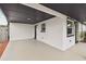 Open carport showcasing the home's exterior and features and the home's side entry at 8108 Fir Dr, Tampa, FL 33619