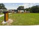 Well-manicured front yard with lush green grass, decorative mailbox and appealing landscaping for great curb appeal at 8108 Fir Dr, Tampa, FL 33619