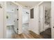 Hallway leading to bright bedroom and an updated bathroom featuring marble accents at 8108 Fir Dr, Tampa, FL 33619