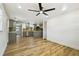 Open concept living room flowing into the kitchen featuring modern flooring and recessed lighting at 8108 Fir Dr, Tampa, FL 33619