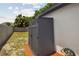 Durable outdoor storage shed in backyard, next to a wooden fence and offering practical storage solutions at 8108 Fir Dr, Tampa, FL 33619