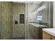 Sleek new shower featuring decorative tile, custom niche and updated fixtures at 8108 Fir Dr, Tampa, FL 33619